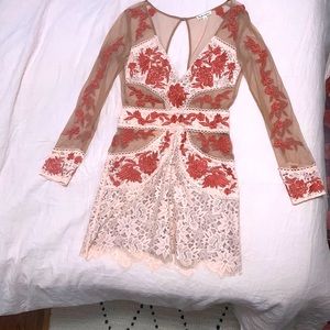 For love and lemons mini dress with mesh cutouts and floral appliqué. Size S